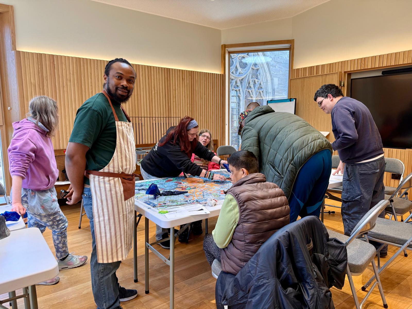 Participants from both groups working together at the Cathedral to join the two sections of the map.